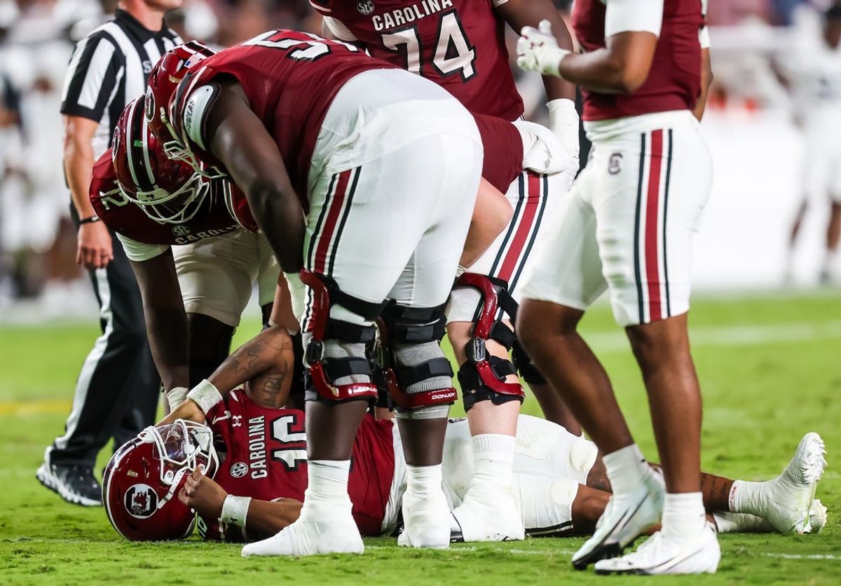 Sep 13, 2025; Columbia, South Carolina, USA; South Carolina Gamecocks quarterback LaNorris Sellers (16) lays on the field after being injured against the Vanderbilt Commodores in the second quarter at Williams-Brice Stadium. Mandatory Credit: Jeff Blake-Imagn Images