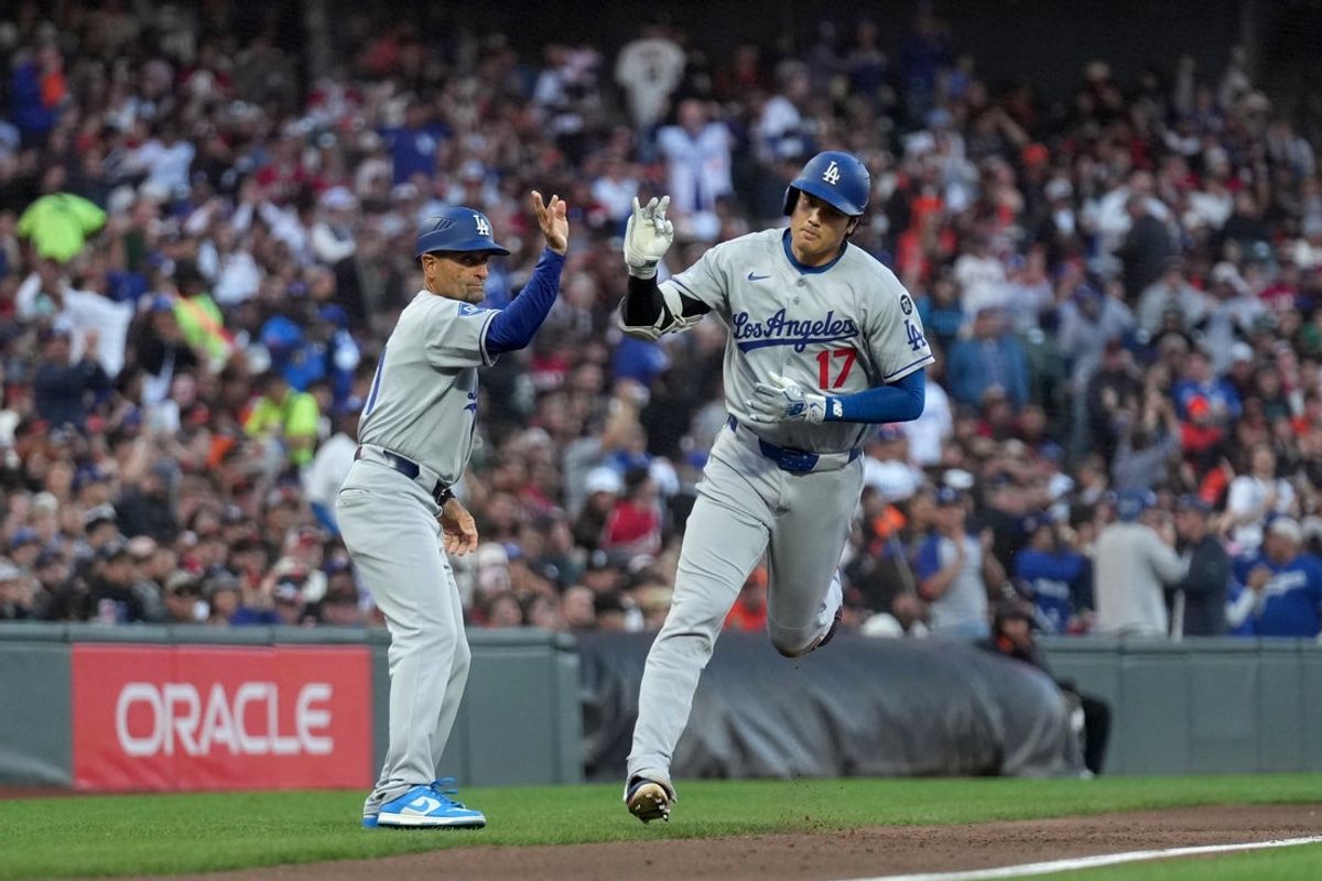 Sep 13, 2025; San Francisco, California, USA; Los Angeles Dodgers designated hitter Shohei Ohtani (17) is congratulated by third base coach Dino Ebel (91) after hitting a home run against the San Francisco Giants in the third inning at Oracle Park. Mandatory Credit: Cary Edmondson-Imagn Images
