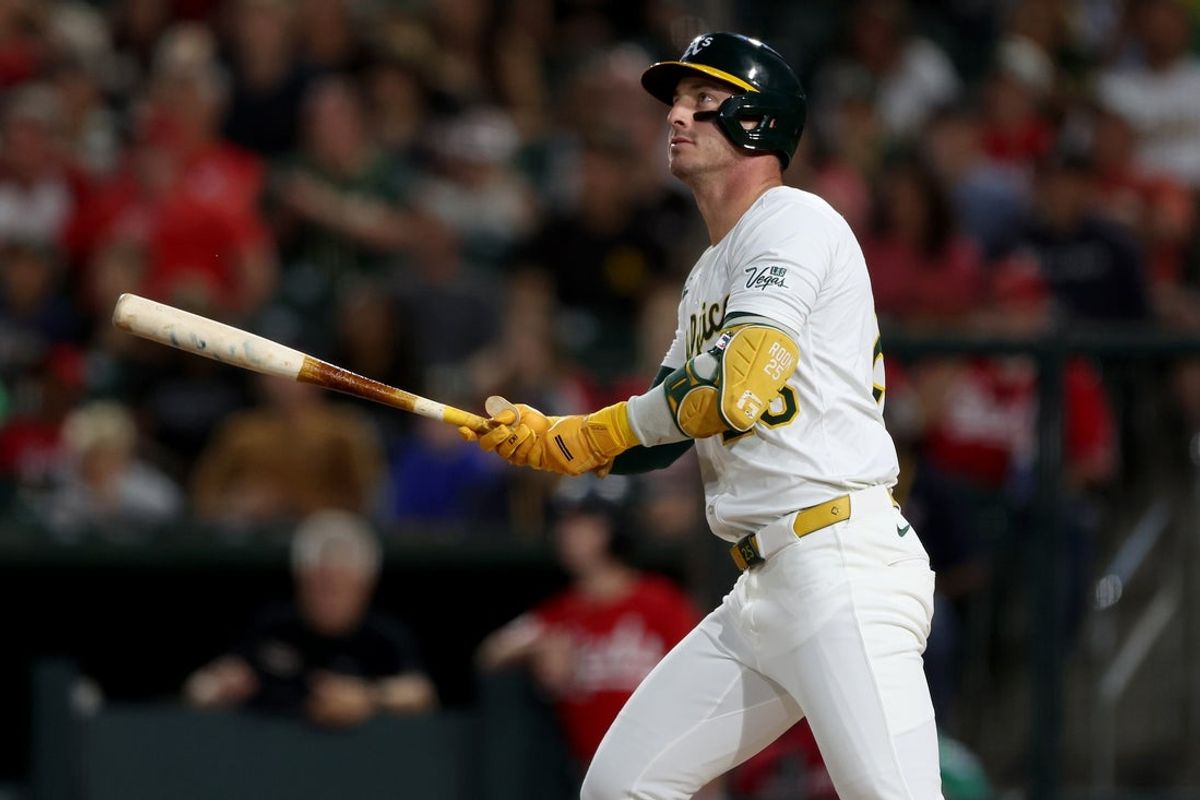 Sep 13, 2025; West Sacramento, California, USA; Athletics designated hitter Brent Rooker (25) hits a solo home run against the Cincinnati Reds during the second inning at Sutter Health Park. Mandatory Credit: Dennis Lee-Imagn Images