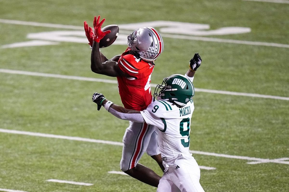 Ohio State Buckeyes wide receiver Jeremiah Smith (4) catches a pass against Ohio Bobcats cornerback Michael Mack II (9) in the second half at the Ohio Stadium on Saturday, Sept. 13, 2025 in Columbus, Ohio.