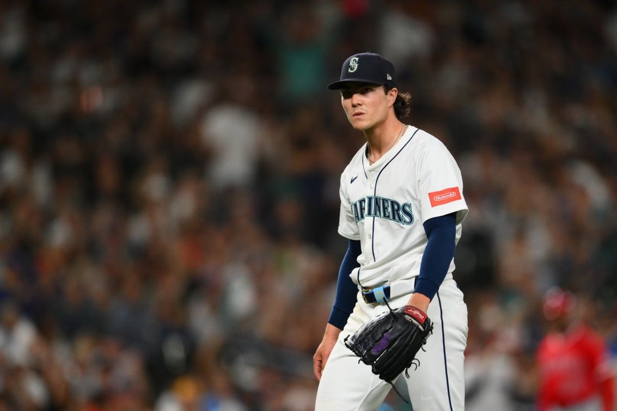 Sep 13, 2025; Seattle, Washington, USA; Seattle Mariners starting pitcher Bryan Woo (22) walks off the field after the final out against the Los Angeles Angels during the sixth inning at T-Mobile Park. Mandatory Credit: Steven Bisig-Imagn Images