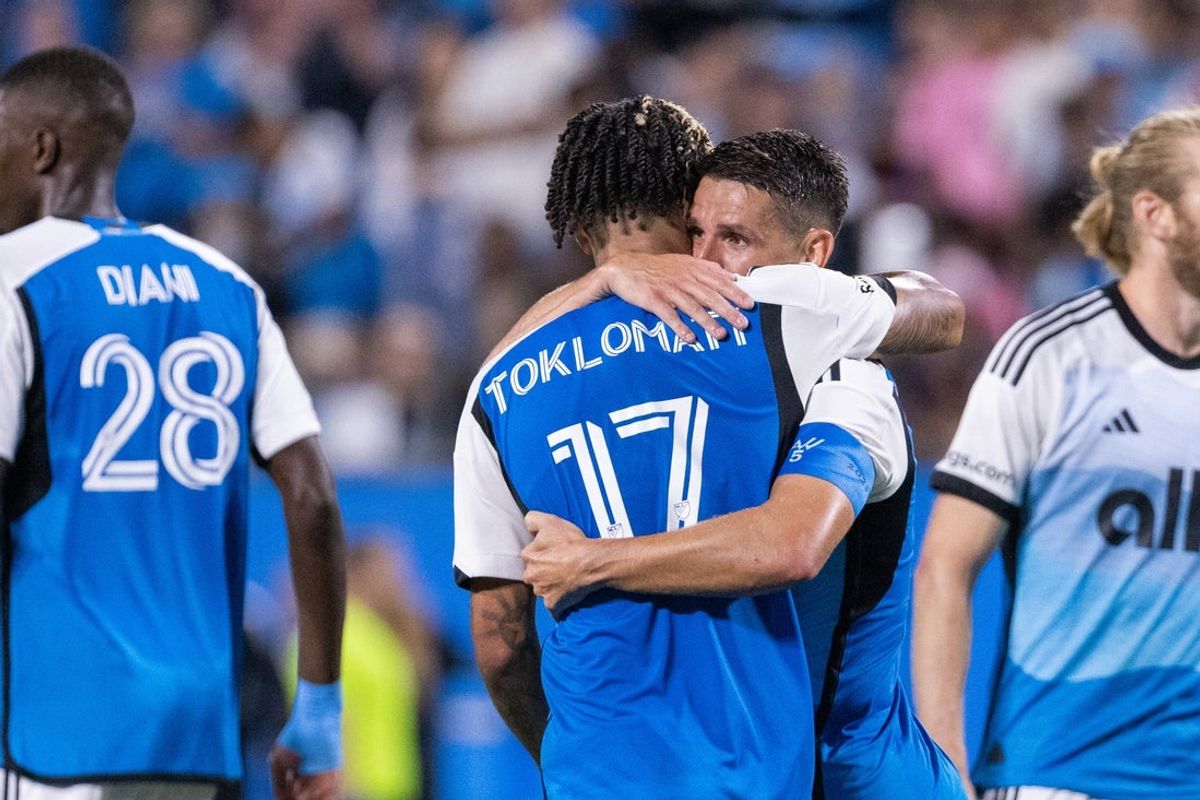 Sep 13, 2025; Charlotte, North Carolina, USA;  Charlotte FC forward Idan Toklomati (17) hugs midfielder Ashley Westwood (8) after scoring against the Inter Miami in the second half at Bank of America Stadium. Mandatory Credit: Scott Kinser-Imagn Images