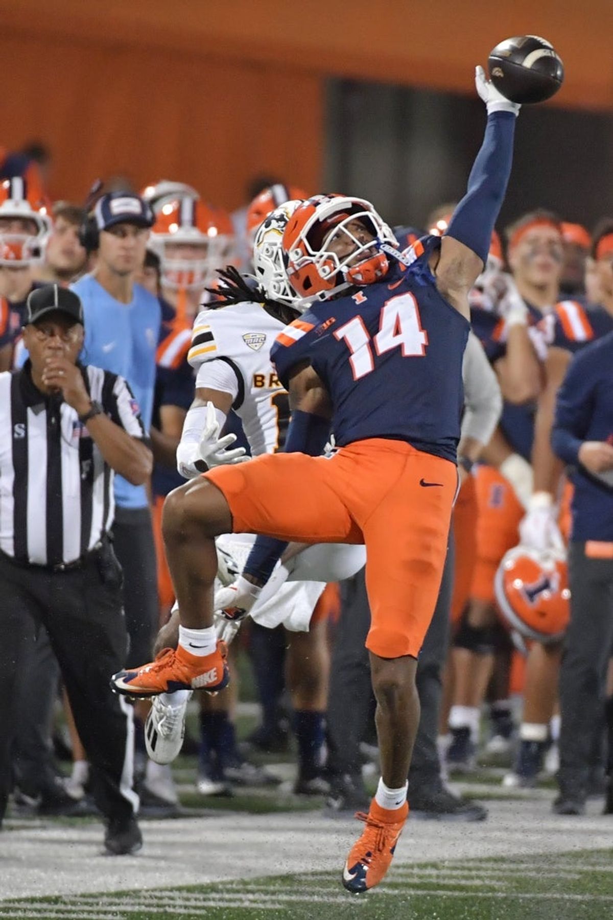 Sep 13, 2025; Champaign, Illinois, USA;  Illinois Fighting Illini defensive back Xavier Scott (14) deflects a pass intended for Western Michigan Broncos wide receiver Aveion Chenault (18) during the second half at Memorial Stadium. Mandatory Credit: Ron Johnson-Imagn Images