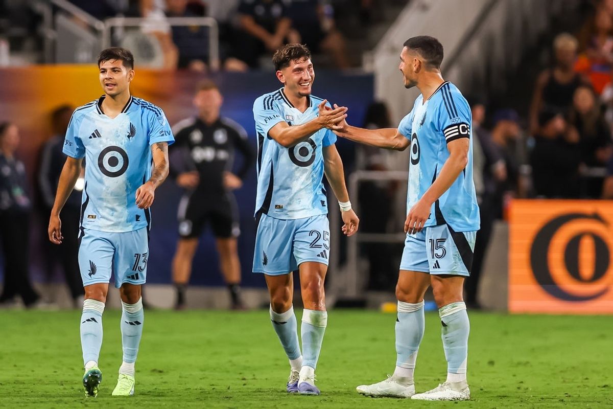 Sep 13, 2025; San Diego, California, USA; Minnesota United midfielder Nectarios Triantis (25) celebrates his second half goal with defender Michael Boxall (15) against San Diego FC at Snapdragon Stadium. Mandatory Credit: Chadd Cady-Imagn Images