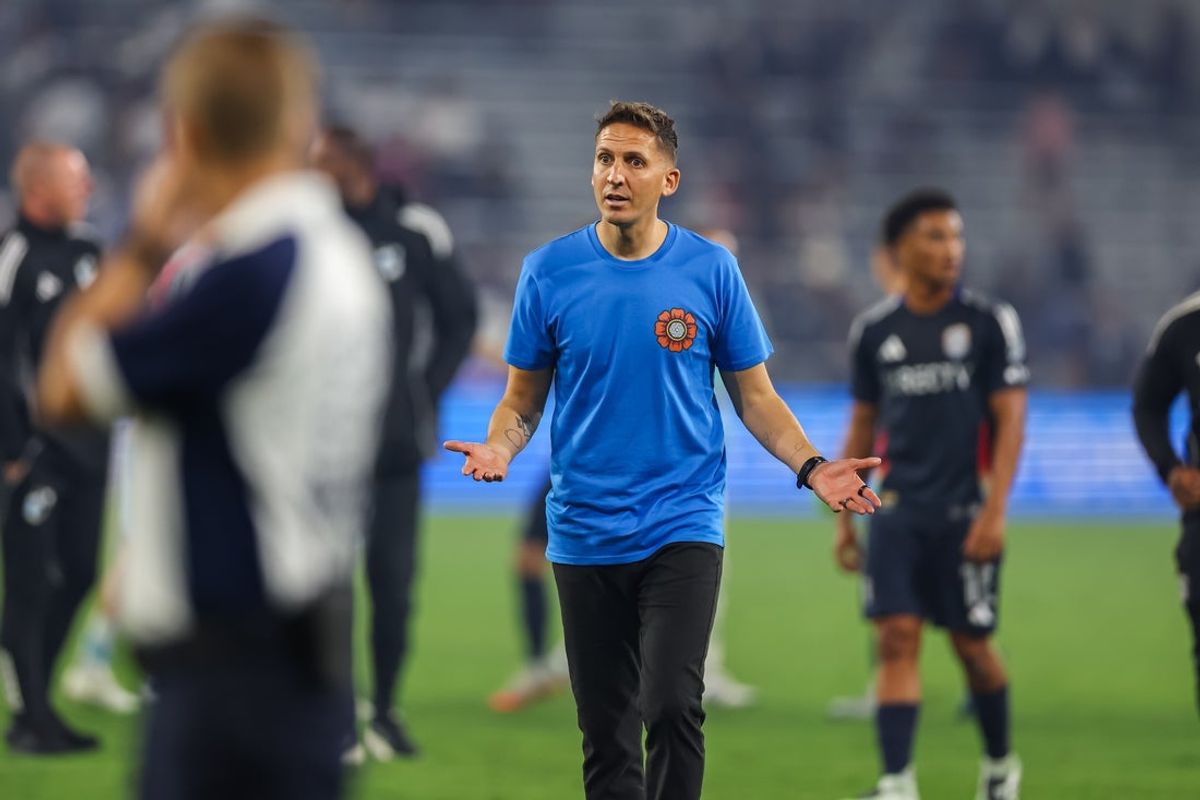 Sep 13, 2025; San Diego, California, USA; San Diego FC head coach Mikey Varas motions to referee Tori Penso after the game after being issued a yellow card during the second half at Snapdragon Stadium. Mandatory Credit: Chadd Cady-Imagn Images