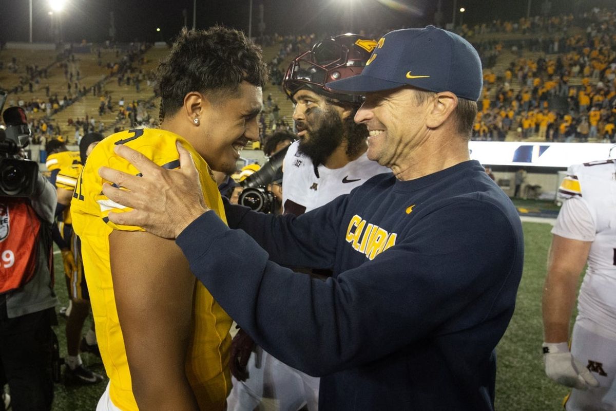 Sep 13, 2025; Berkeley, California, USA; California Golden Bears head coach Justin Wilcox (right) hugs quarterback Jaron-Keawe Sagapolutele (3) following their 27-14 victory over the Minnesota Golden Gophers at California Memorial Stadium. Mandatory Credit: D. Ross Cameron-Imagn Images