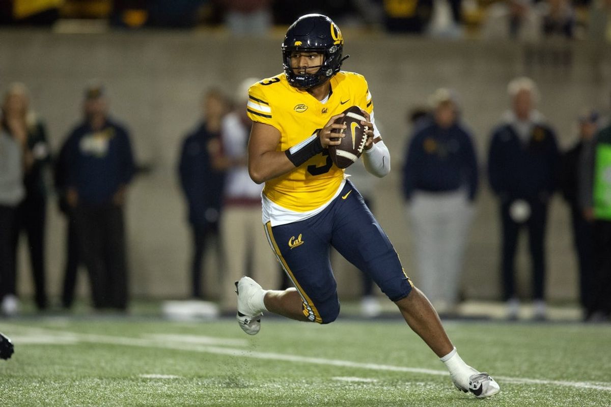 Sep 13, 2025; Berkeley, California, USA; California Golden Bears quarterback Jaron-Keawe Sagapolutele (3) rolls out to pass against the Minnesota Golden Gophers during the fourth quarter at California Memorial Stadium. Mandatory Credit: D. Ross Cameron-Imagn Images