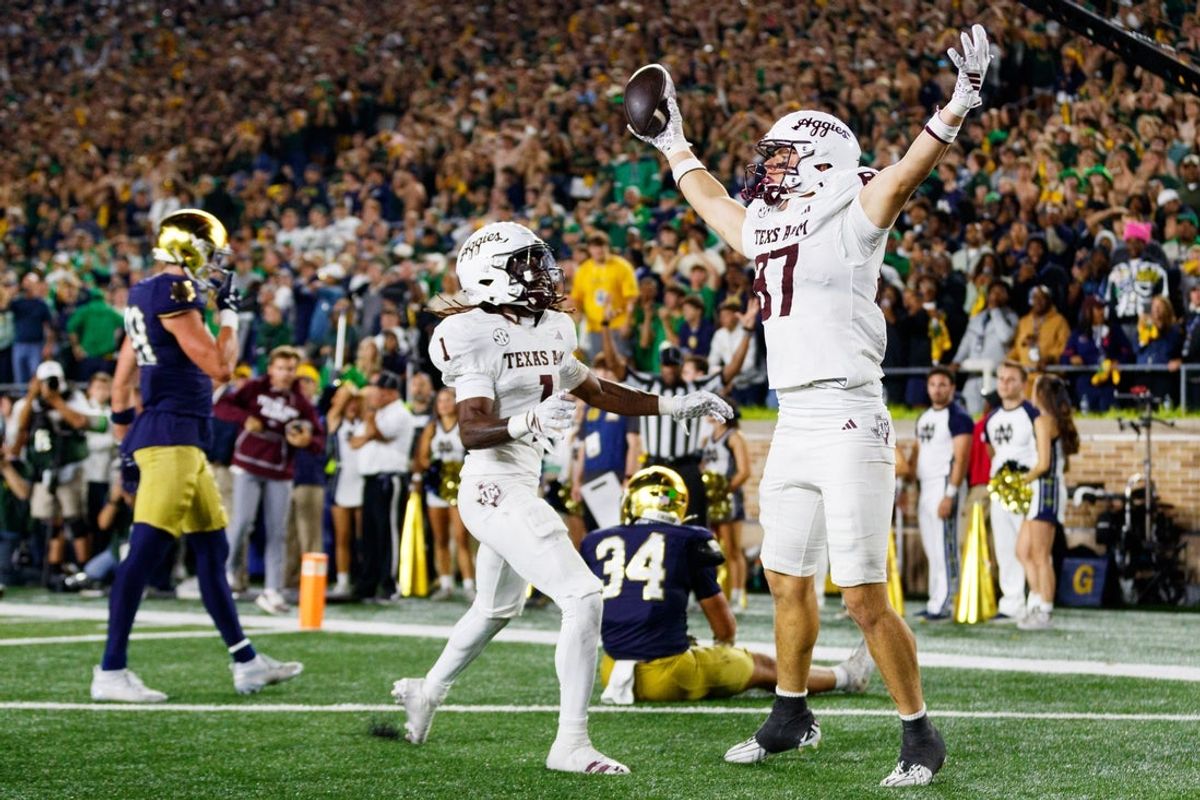 Texas A&M tight end Nate Boerkircher (87) celebrates after scoring a touchdown to tie the game in the second half of a NCAA football game against Notre Dame at Notre Dame Stadium on Saturday, Sept. 13, 2025, in South Bend. The extra point scored after this touchdown put Texas A&M ahead 41-40 to win the game.