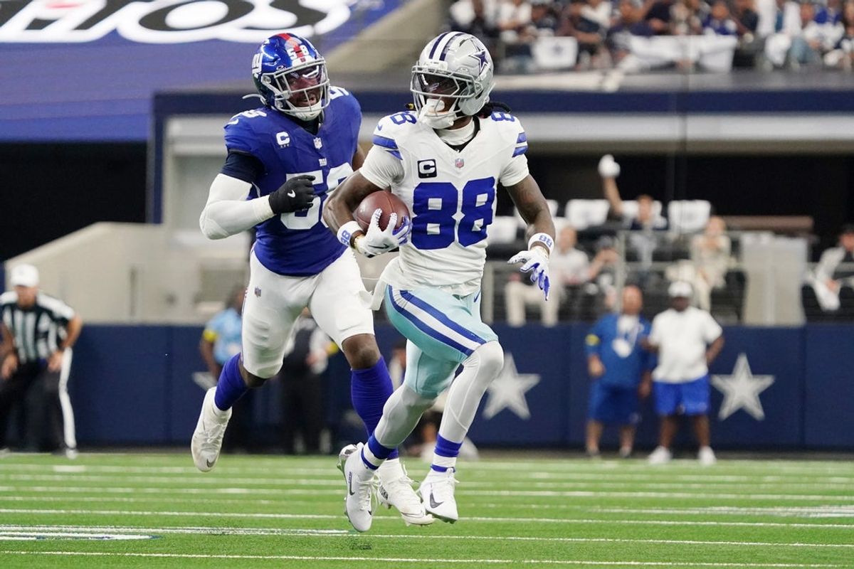 Sep 14, 2025; Arlington, Texas, USA; Dallas Cowboys wide receiver CeeDee Lamb (88) runs with the ball against the New York Giants during the second quarter at AT&T Stadium. Mandatory Credit: Raymond Carlin III-Imagn Images