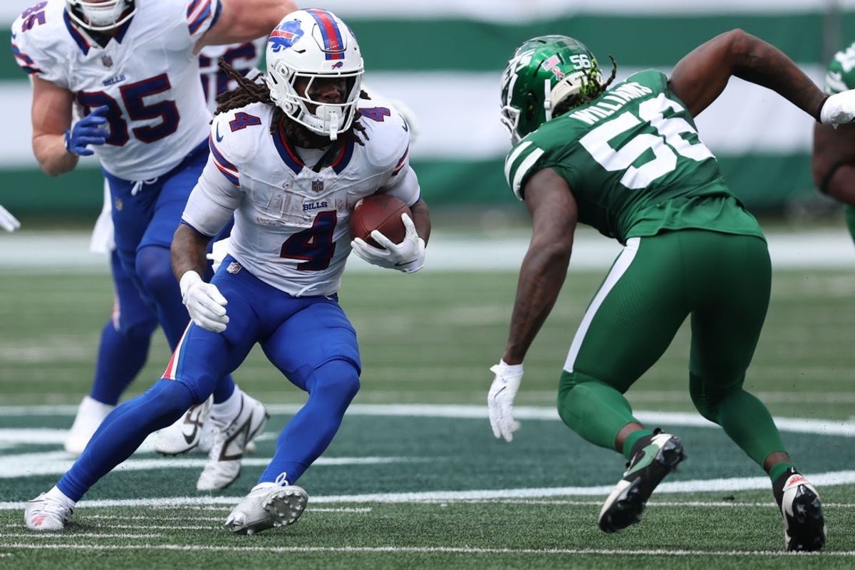 Sep 14, 2025; East Rutherford, New Jersey, USA; Buffalo Bills running back James Cook (4) rushes the ball against the New York Jets during the first half at MetLife Stadium. Mandatory Credit: Vincent Carchietta-Imagn Images