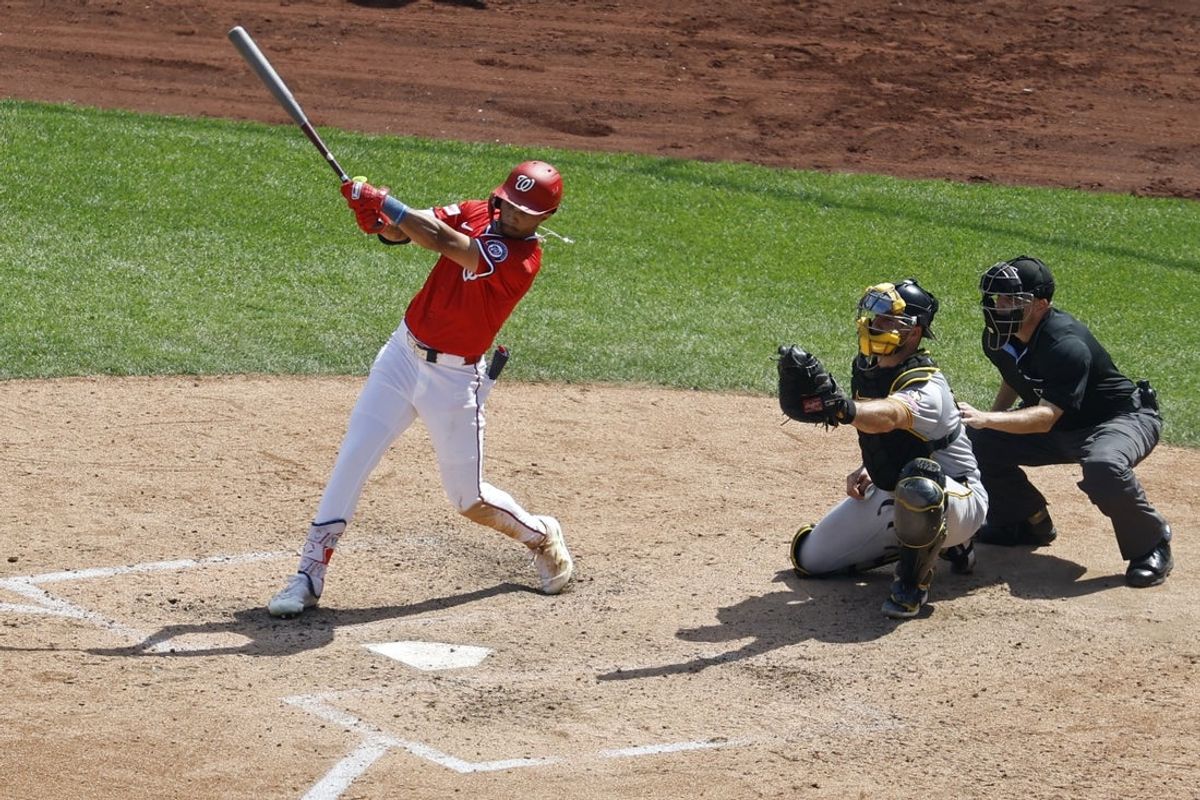 Sep 14, 2025; Washington, District of Columbia, USA; Washington Nationals outfielder Daylen Lile (51) doubles against the Pittsburgh Pirates during the eighth inning at Nationals Park. Mandatory Credit: Geoff Burke-Imagn Images