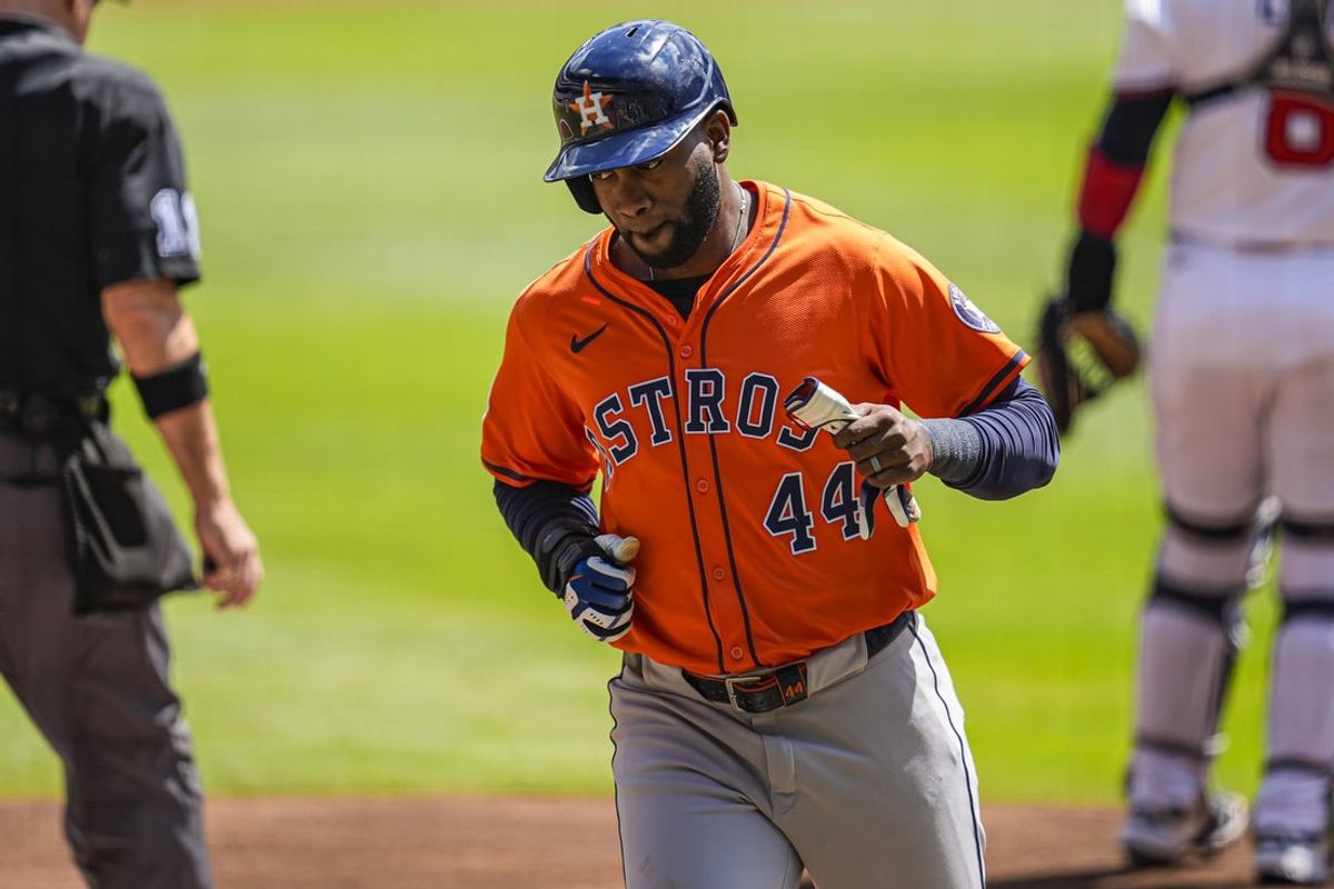Sep 14, 2025; Cumberland, Georgia, USA; Houston Astros left fielder Yordan Alvarez (44) scores a run against the Atlanta Braves during the first inning at Truist Park. Mandatory Credit: Dale Zanine-Imagn Images