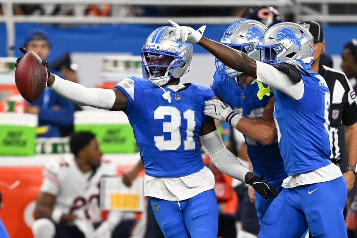 Detroit Lions safety Kerby Joseph (31) celebrates with teammates after inception against the Chicago Bears during the second quarter of the game at Ford Field.