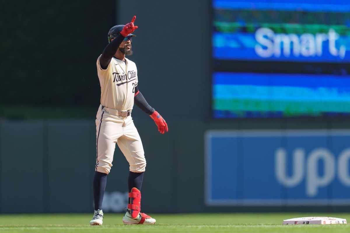 Sep 14, 2025; Minneapolis, Minnesota, USA; Minnesota Twins center fielder Byron Buxton (25) doubles off Arizona Diamondbacks pitcher Nabil Crismatt (61) in the second inning at Target Field. Mandatory Credit: Matt Blewett-Imagn Images