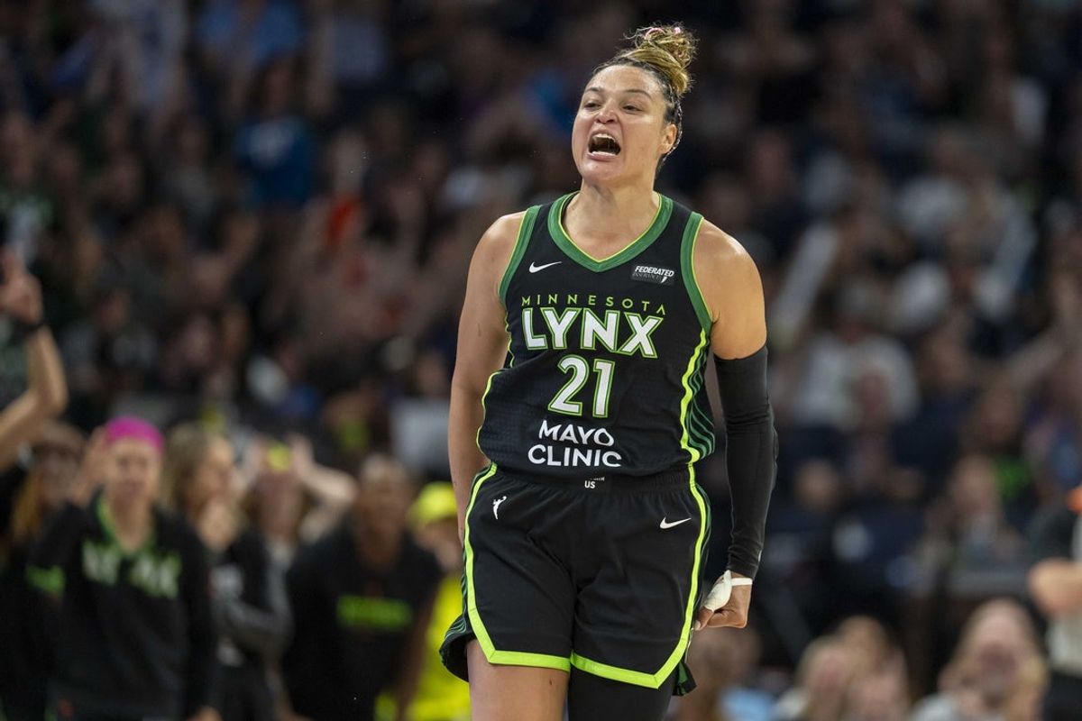 Sep 14, 2025; Minneapolis, Minnesota, USA; Minnesota Lynx guard Kayla McBride (21) celebrates making a shot against the Golden State Valkyries in the second half during game one of round one for the 2025 WNBA Playoffs at Target Center. Mandatory Credit: Jesse Johnson-Imagn Images