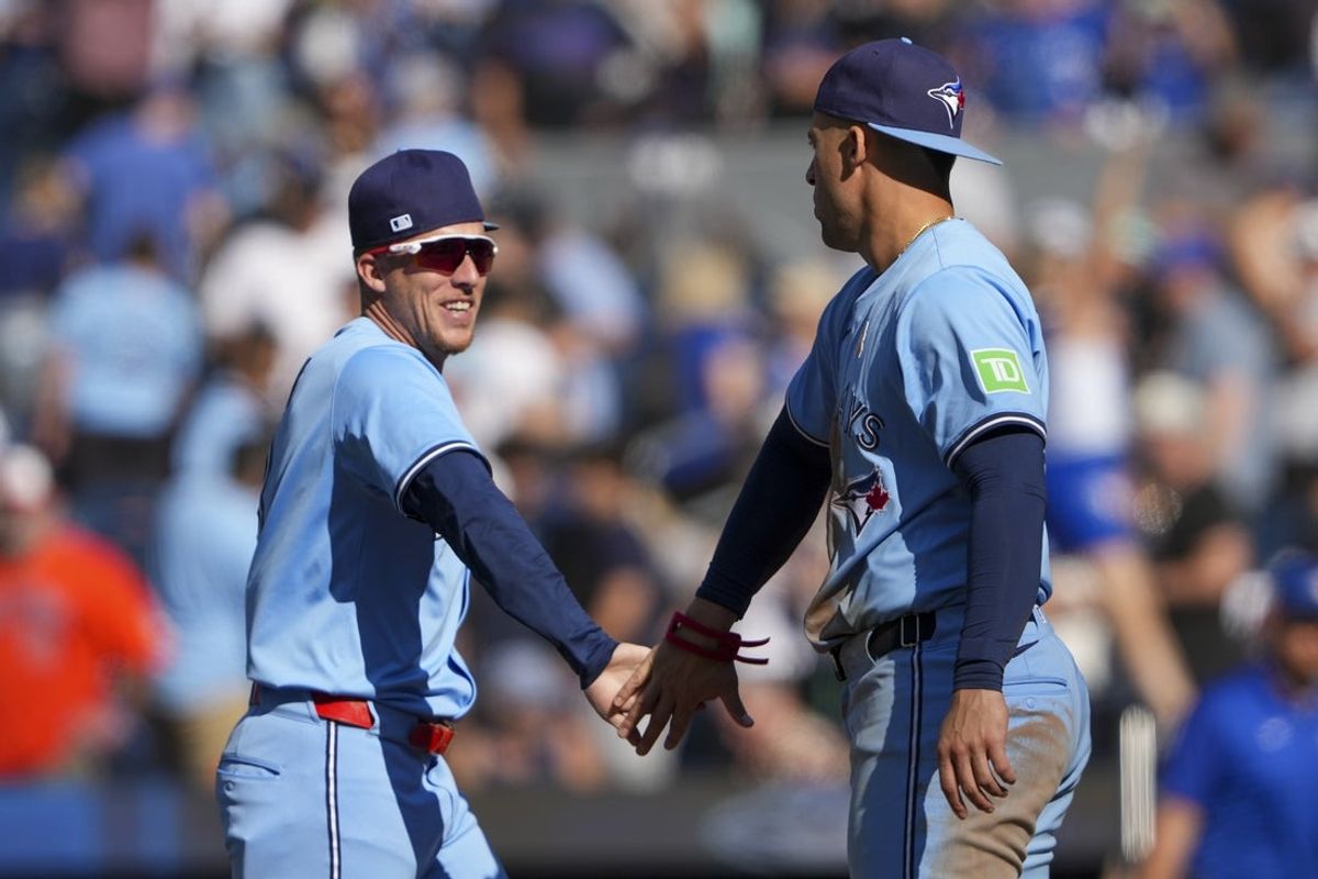 Sep 14, 2025; Toronto, Ontario, CAN; Toronto Blue Jays outfielder Myles Straw (3) and outfielder George Springer (4) celebrate defeating the Baltimore Orioles at Rogers Centre. Mandatory Credit: Kevin Sousa-Imagn Images