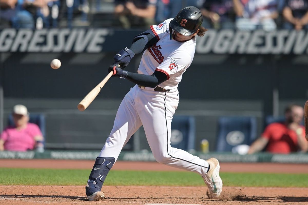 Sep 14, 2025; Cleveland, Ohio, USA; Cleveland Guardians catcher Bo Naylor (23) hits a home run against the Chicago White Sox during the seventh inning at Progressive Field. Mandatory Credit: Ken Blaze-Imagn Images