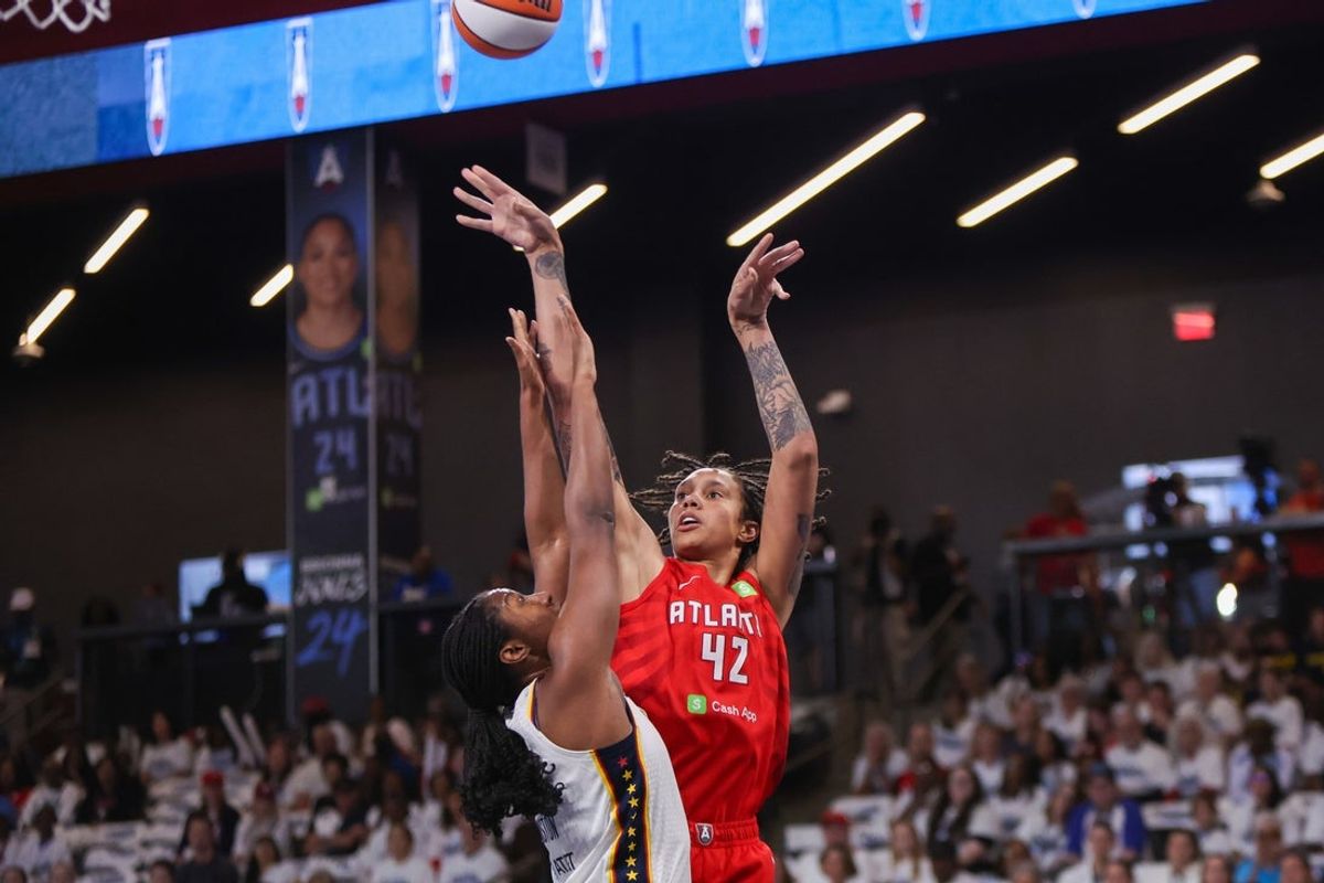 Sep 14, 2025; College Park, Georgia, USA; Atlanta Dream center Brittney Griner (42) shoots over Indiana Fever forward Aliyah Boston (7) in the first quarter during game one of round one for the 2025 WNBA Playoffs at Gateway Center Arena at College Park. Mandatory Credit: Brett Davis-Imagn Images