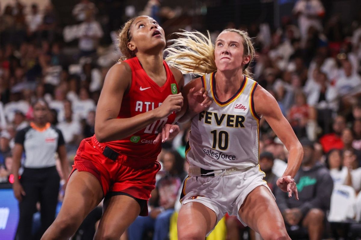 Sep 14, 2025; College Park, Georgia, USA; Atlanta Dream forward Naz Hillmon (00) boxes out Indiana Fever guard Lexie Hull (10) in the second quarter during game one of round one for the 2025 WNBA Playoffs at Gateway Center Arena at College Park. Mandatory Credit: Brett Davis-Imagn Images