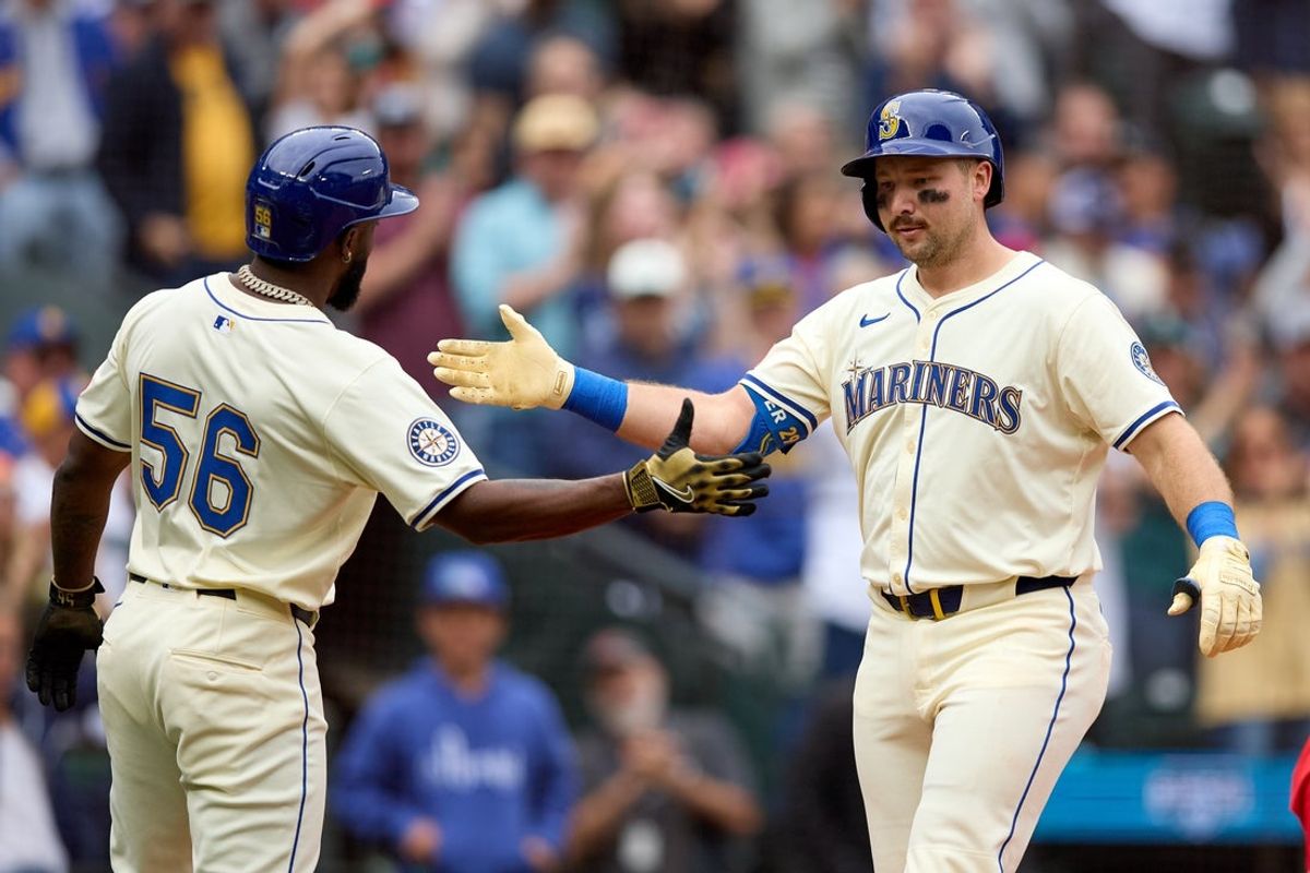 Sep 14, 2025; Seattle, Washington, USA;  Seattle Mariners catcher Cal Raleigh (29) is greeted by left fielder Randy Arozarena (56) on his two-run home run off in the first inning  against the Los Angeles Angels at T-Mobile Park. Mandatory Credit: John Froschauer-Imagn Images