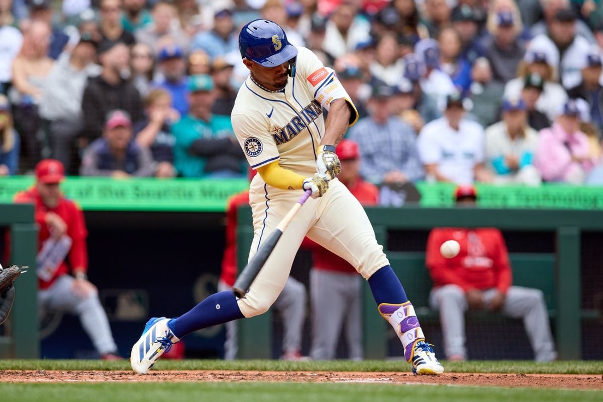 Sep 14, 2025; Seattle, Washington, USA; Seattle Mariners center fielder Julio Rodríguez (44) hits an RBI double against the Los Angeles Angels during the third inning at T-Mobile Park. Mandatory Credit: John Froschauer-Imagn Images