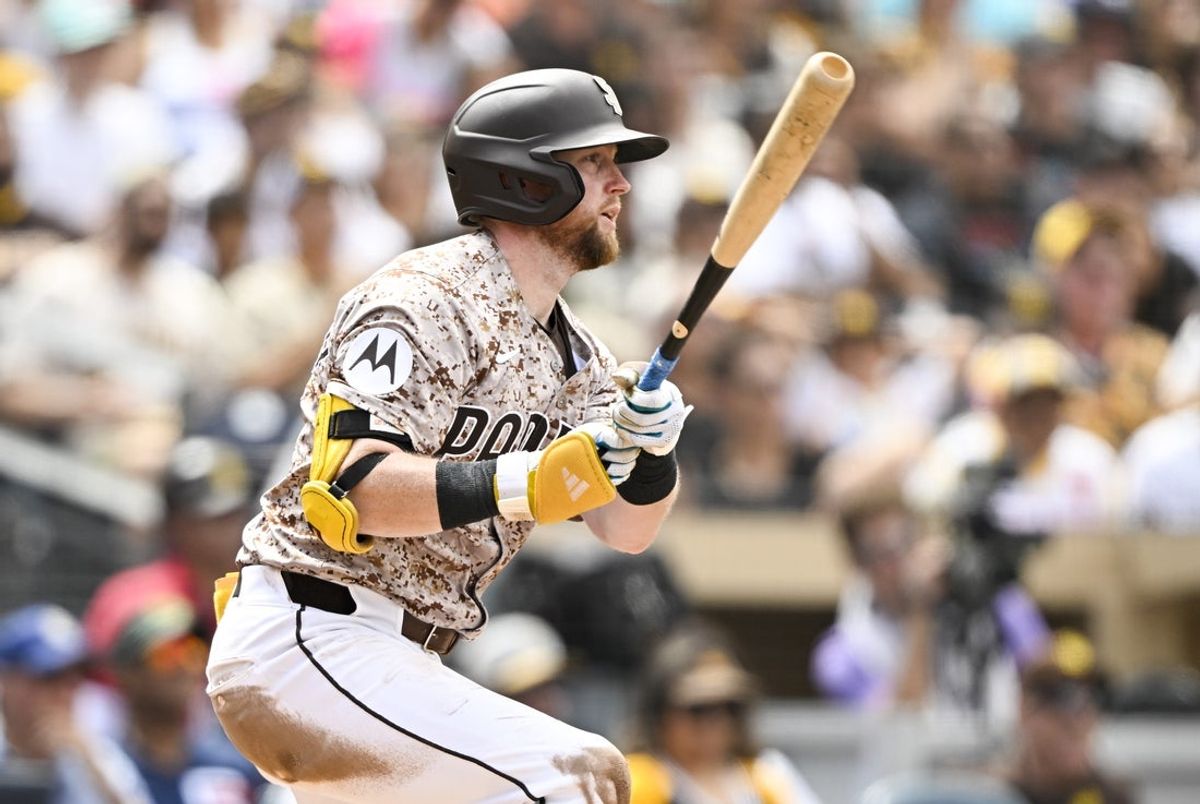 Sep 14, 2025; San Diego, California, USA; San Diego Padres second baseman Jake Cronenworth (9) hits a single during the third inning against the Colorado Rockies at Petco Park. Mandatory Credit: Denis Poroy-Imagn Images