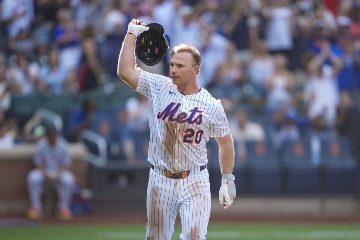 Sep 14, 2025; New York City, New York, USA; New York Mets first baseman Pete Alonso (20) throws his helmet after hitting a walk off three run home run against the Texas Rangers during the tenth inning at Citi Field. Mandatory Credit: Gregory Fisher-Imagn Images