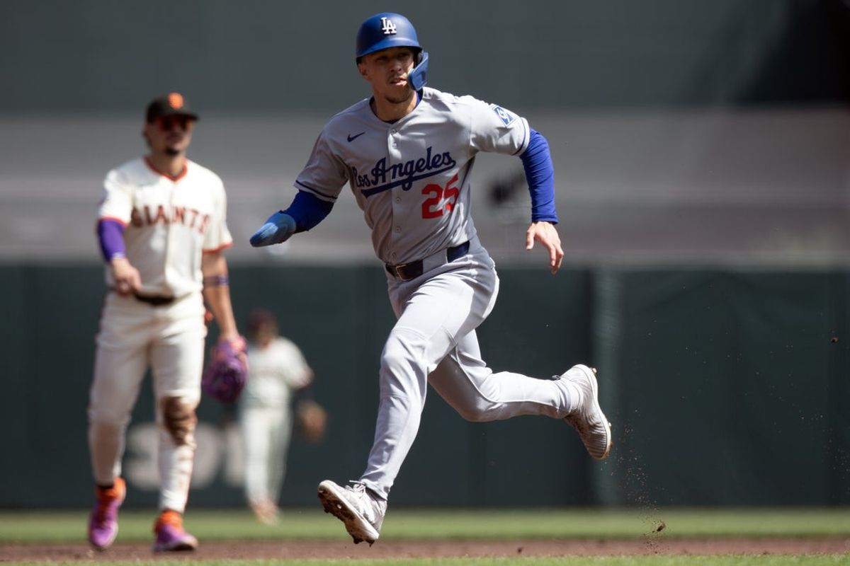 Sep 14, 2025; San Francisco, California, USA; Los Angeles Dodgers center fielder Tommy Edman (25) advances from second to third on a wild pitch by San Francisco Giants starting pitcher Robbie Ray during the second inning at Oracle Park. Mandatory Credit: D. Ross Cameron-Imagn Images