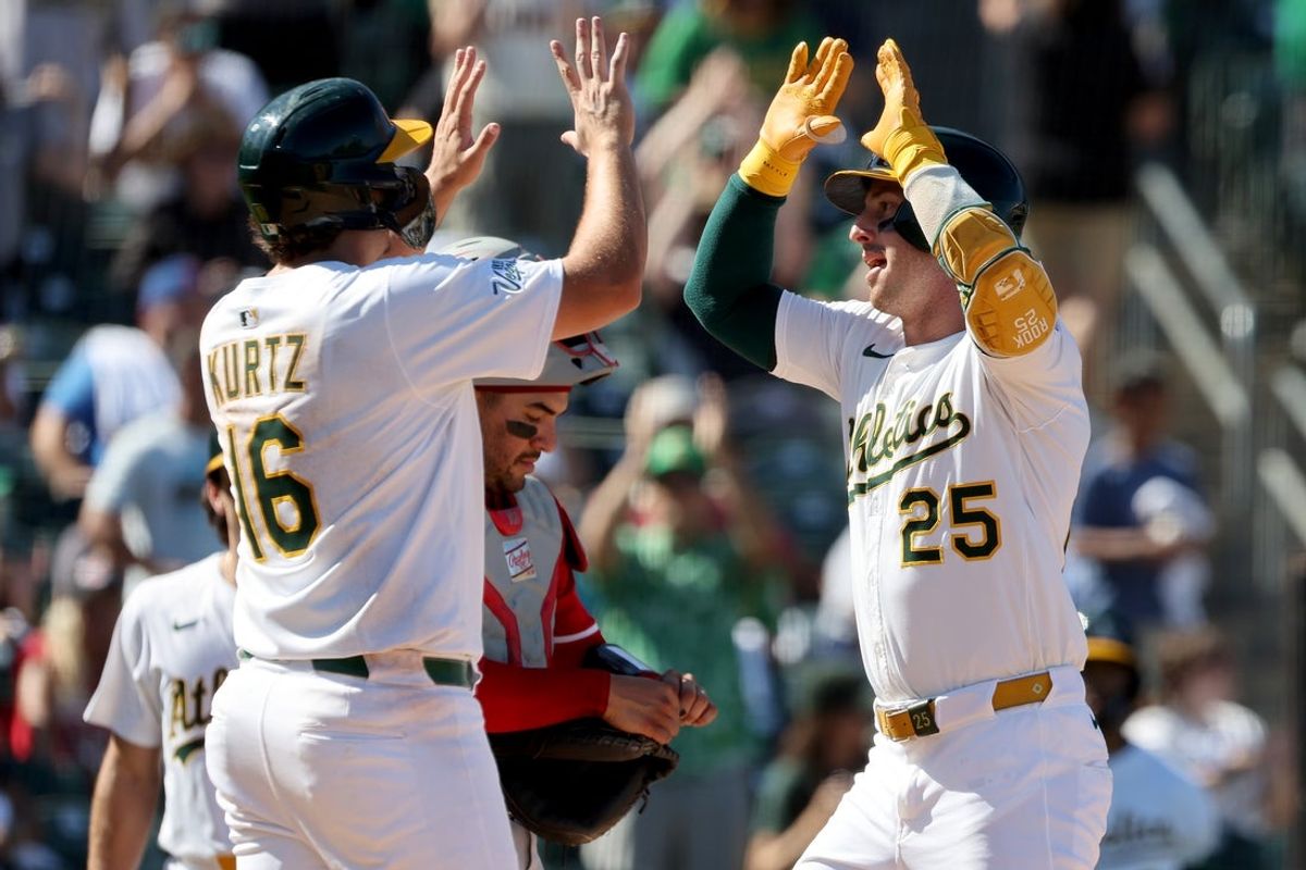 Sep 14, 2025; West Sacramento, California, USA; Athletics right fielder Brent Rooker (25) is congratulated by first baseman Nick Kurtz (16) after hitting a two-run home run against the Cincinnati Reds during the seventh inning at Sutter Health Park. Mandatory Credit: Dennis Lee-Imagn Images