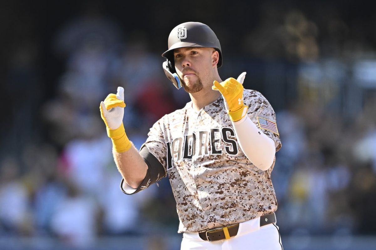 Sep 14, 2025; San Diego, California, USA; San Diego Padres desingnated hitter Gavin Sheets (30) gestures after hitting an RBI double during the eighth inning against the Colorado Rockies at Petco Park. Mandatory Credit: Denis Poroy-Imagn Images
