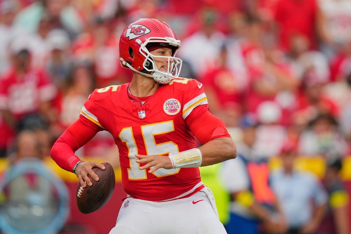 Sep 14, 2025; Kansas City, Missouri, USA; Kansas City Chiefs quarterback Patrick Mahomes (15) passes the ball against the Philadelphia Eagles during the fourth quarter of the game at GEHA Field at Arrowhead Stadium. Mandatory Credit: Jay Biggerstaff-Imagn Images