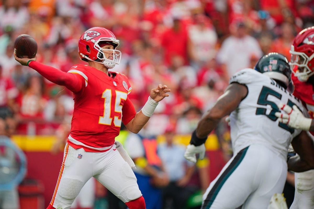 Sep 14, 2025; Kansas City, Missouri, USA; Kansas City Chiefs quarterback Patrick Mahomes (15) passes the ball against the Philadelphia Eagles during the fourth quarter of the game at GEHA Field at Arrowhead Stadium. Mandatory Credit: Jay Biggerstaff-Imagn Images