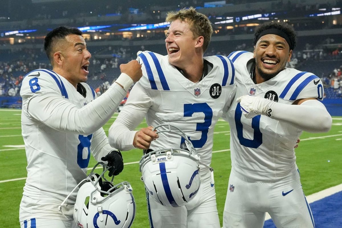 Indianapolis Colts punter Rigoberto Sanchez (8), Indianapolis Colts place kicker Spencer Shrader (3) and Indianapolis Colts safety Cam Bynum (0) celebrate as the leave the field Sunday, Sept. 14, 2025, after a game against the Denver Broncos at Lucas Oil Stadium in Indianapolis. A field goal by Indianapolis Colts place kicker Spencer Shrader (3) won the game for the Indianapolis Colts.