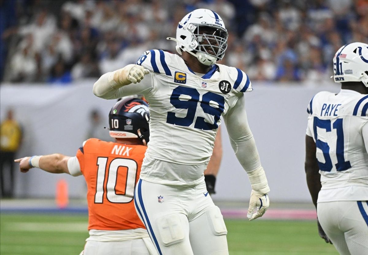 Sep 14, 2025; Indianapolis, Indiana, USA; Indianapolis Colts defensive tackle DeForest Buckner (99) celebrates a tackle against Denver Broncos quarterback Bo Nix (10) during the fourth quarter at Lucas Oil Stadium. Mandatory Credit: Robert Goddin-Imagn Images