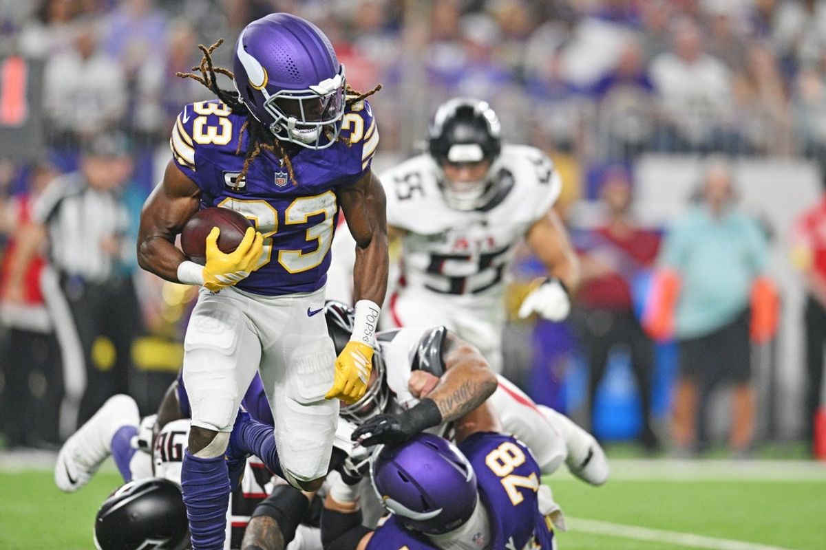 Sep 14, 2025; Minneapolis, Minnesota, USA; Minnesota Vikings running back Aaron Jones Sr. (33) runs the ball during the first half against the Atlanta Falcons at U.S. Bank Stadium. Mandatory Credit: Jeffrey Becker-Imagn Images
