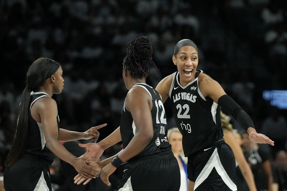 Sep 14, 2025; Las Vegas, Nevada, USA;Las Vegas Aces center A'ja Wilson (22) celebrates scoring on the Seattle Storm in the third quarter during game one of round one for the 2025 WNBA Playoffs at Michelob Ultra Arena. Mandatory Credit: Candice Ward-Imagn Images