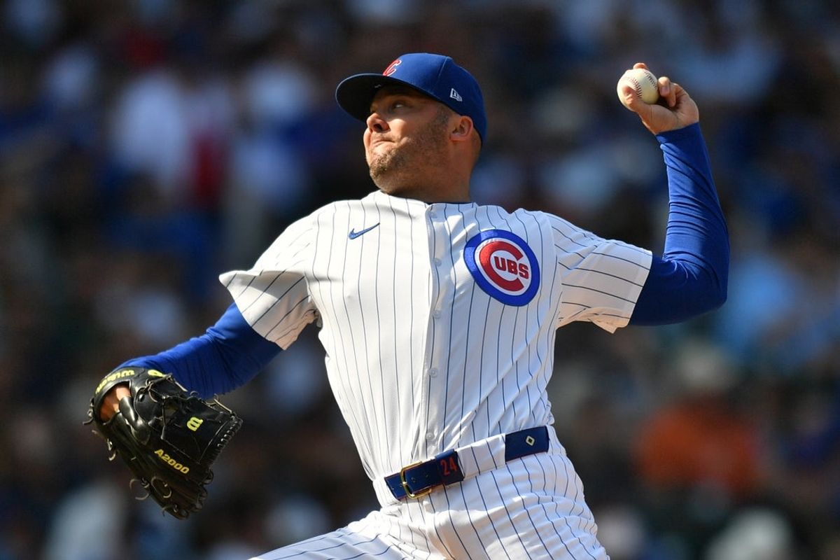 Sep 13, 2025; Chicago, Illinois, USA; Chicago Cubs pitcher Caleb Thielbar (24) pitches against the Tampa Bay Rays during a game at Wrigley Field. Mandatory Credit: Patrick Gorski-Imagn Images