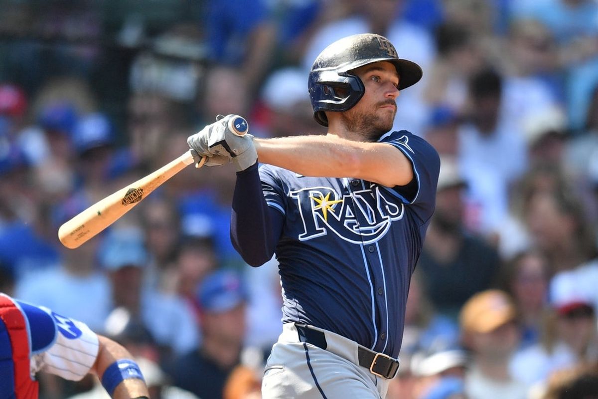 Sep 13, 2025; Chicago, Illinois, USA; Tampa Bay Rays second baseman Brandon Lowe (8) hits an RBI single against the Chicago Cubs during the sixth inning at Wrigley Field. Mandatory Credit: Patrick Gorski-Imagn Images
