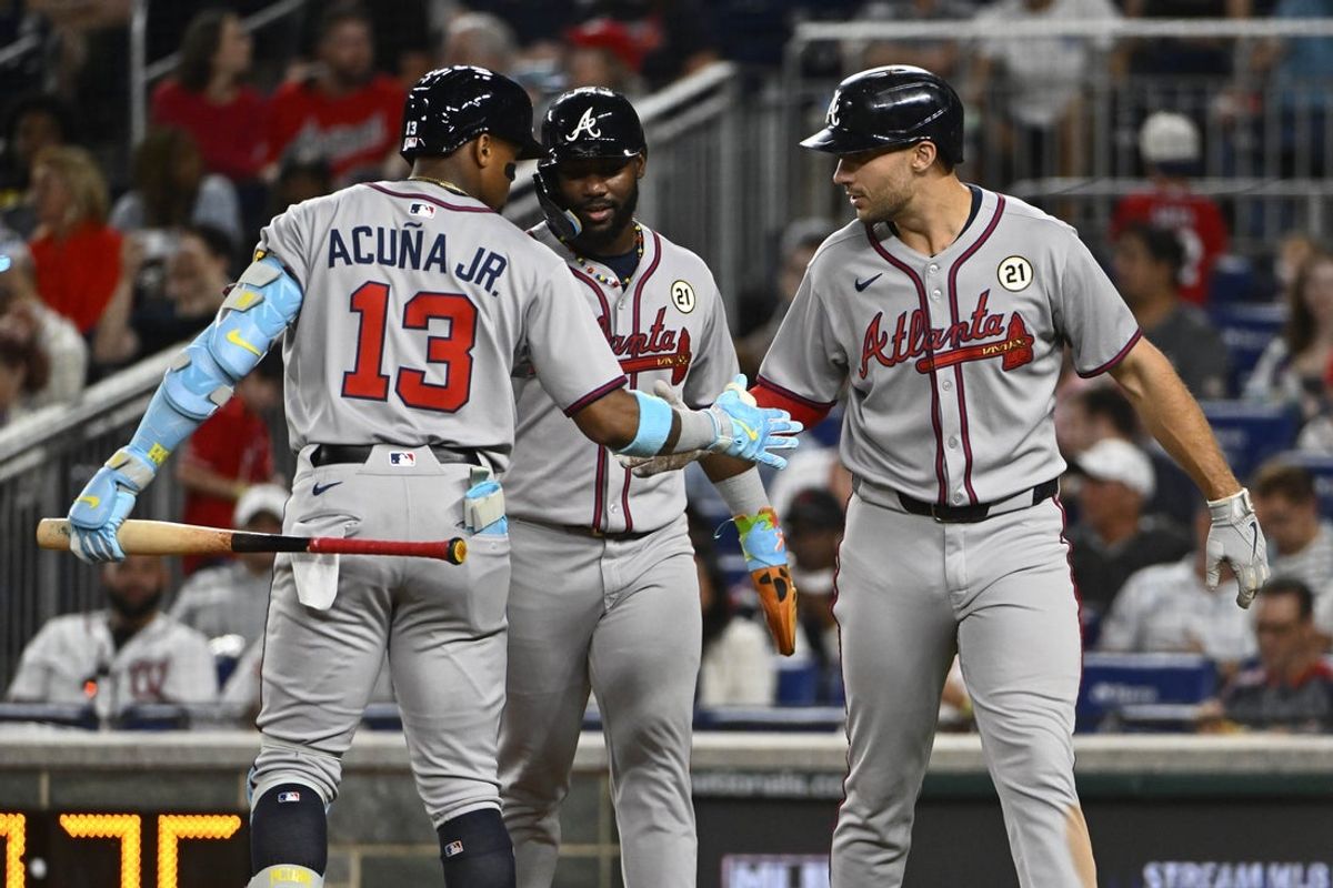 Sep 15, 2025; Washington, District of Columbia, USA; Atlanta Braves first baseman Matt Olson (28) is congratulated by Atlanta Braves right fielder Ronald Auna Jr. after hitting a three run home run during the fifth inning at Nationals Park. Mandatory Credit: Brad Mills-Imagn Images