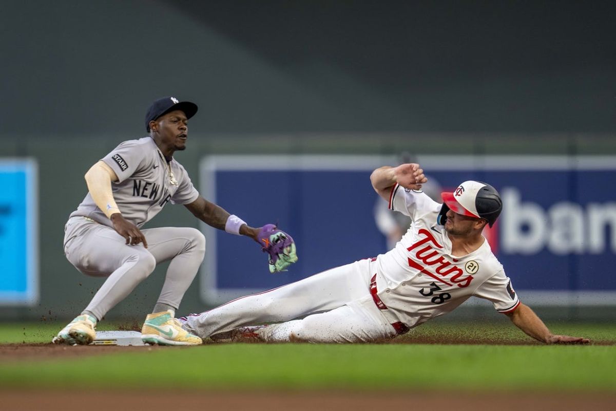 Sep 15, 2025; Minneapolis, Minnesota, USA; Minnesota Twins right fielder Matt Wallner (38) slides into second base before New York Yankees second baseman Jazz Chisholm Jr. (13) can make a tag in the second inning at Target Field. Mandatory Credit: Jesse Johnson-Imagn Images