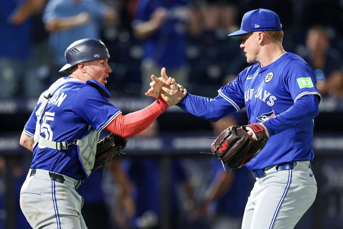 Sep 15, 2025; Tampa, Florida, USA; Toronto Blue Jays catcher Tyler Heineman (55) and pitcher Braydon Fisher (63) celebrate after beating the Tampa Bay Rays in extra inning at George M. Steinbrenner Field. Mandatory Credit: Nathan Ray Seebeck-Imagn Images