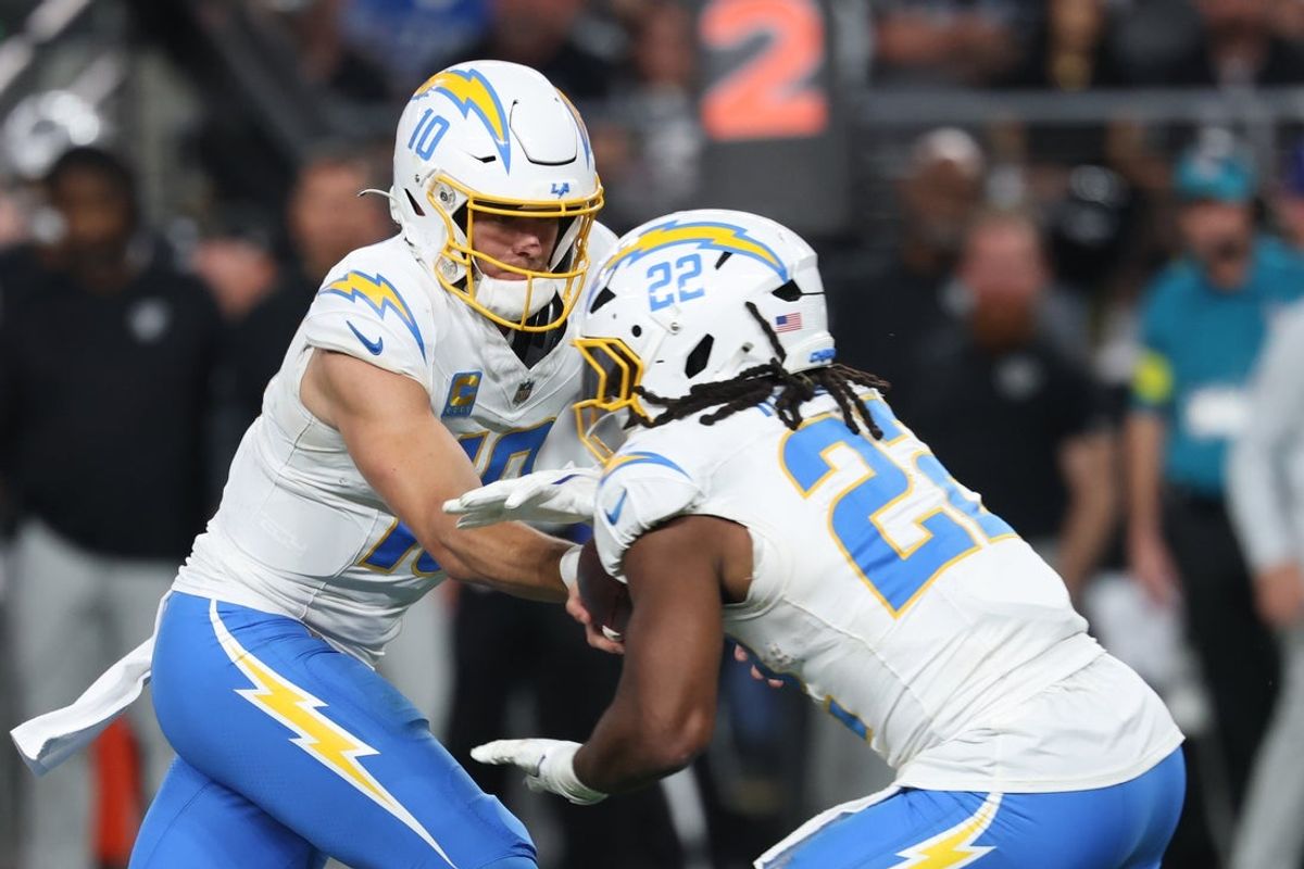 Sep 15, 2025; Paradise, Nevada, USA; Los Angeles Chargers quarterback Justin Herbert (10) hands the ball off to Los Angeles Chargers running back Najee Harris (22) at Allegiant Stadium. Mandatory Credit: Kiyoshi Mio-Imagn Images