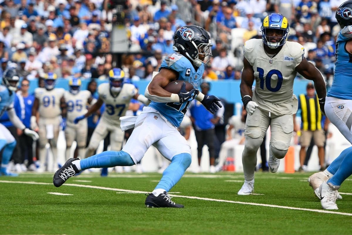 Sep 14, 2025; Nashville, Tennessee, USA;  Tennessee Titans wide receiver Calvin Ridley (0) runs with the ball against the Los Angeles Rams during the second half at Nissan Stadium. Mandatory Credit: Steve Roberts-Imagn Images