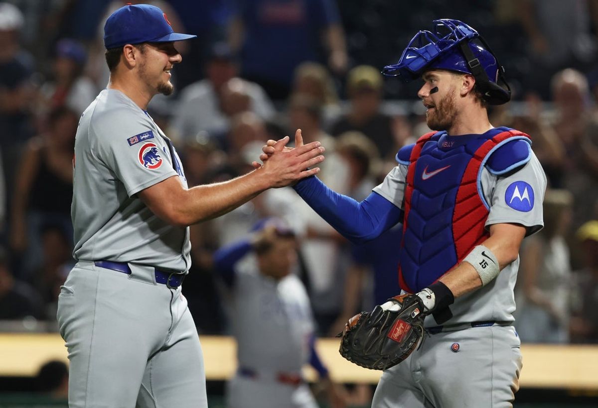 Sep 16, 2025; Pittsburgh, Pennsylvania, USA;  Chicago Cubs relief pitcher Brad Keller (40) and catcher Carson Kelly (15) celebrate after defeating  the Pittsburgh Pirates at PNC Park. Mandatory Credit: Charles LeClaire-Imagn Images