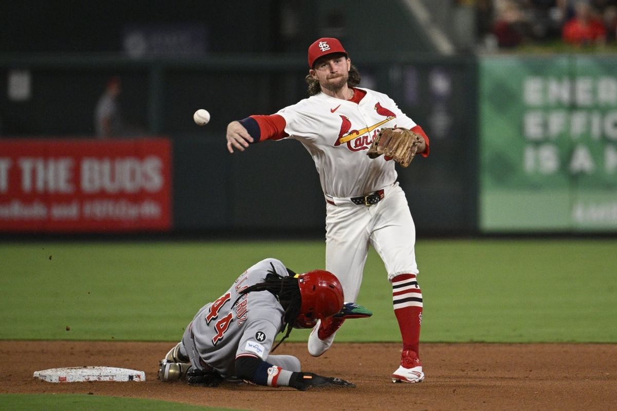 Sep 16, 2025; St. Louis, Missouri, USA; Cincinnati Reds shortstop Elly De La Cruz (44) is out at second base as St. Louis Cardinals second baseman Brendan Donovan (33) turns a double play in the fifth inning at Busch Stadium. Mandatory Credit: Joe Puetz-Imagn Images
