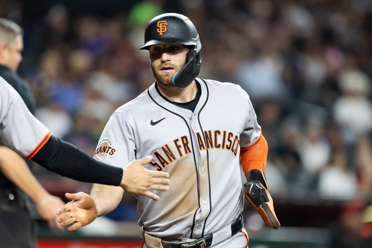 Sep 16, 2025; Phoenix, Arizona, USA; San Francisco Giants base runner Casey Schmitt scores in the first inning against the Arizona Diamondbacks at Chase Field. Mandatory Credit: Mark J. Rebilas-Imagn Images
