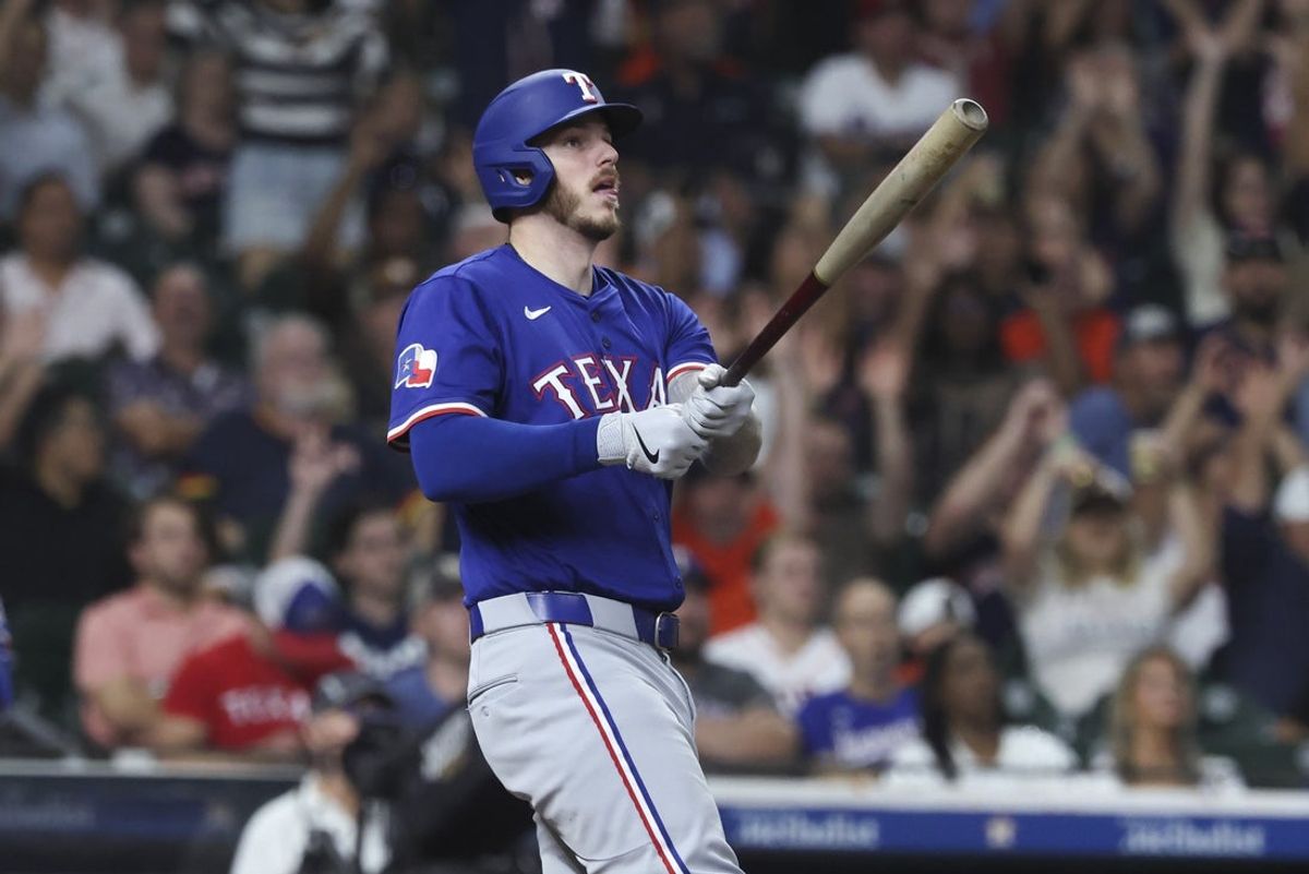 Sep 16, 2025; Houston, Texas, USA; Texas Rangers pinch hitter Jonah Heim (28) hits a home run during the eighth inning against the Houston Astros at Daikin Park. Mandatory Credit: Troy Taormina-Imagn Images