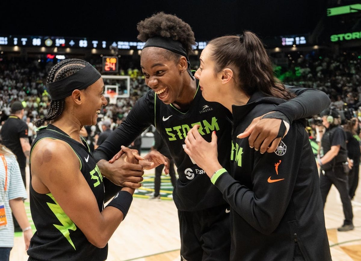 Sep 16, 2025; Seattle, Washington, USA; Seattle Storm, from left, guard Brittney Sykes (20), center Dominique Malonga (14) and forward Katie Lou Samuelson (33) celebrate game two of round one for the 2025 WNBA Playoffs against the Las Vegas Aces at Climate Pledge Arena. Mandatory Credit: Stephen Brashear-Imagn Images