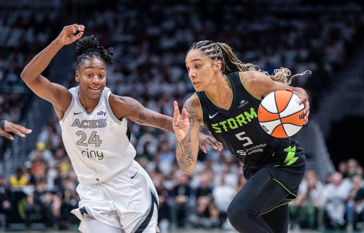 Sep 16, 2025; Seattle, Washington, USA; Seattle Storm forward Gabby Williams (5) dribbles the ball against Las Vegas Aces guard Jewell Loyd (24) in the first half during game two of round one for the 2025 WNBA Playoffs at Climate Pledge Arena. Mandatory Credit: Stephen Brashear-Imagn Images
