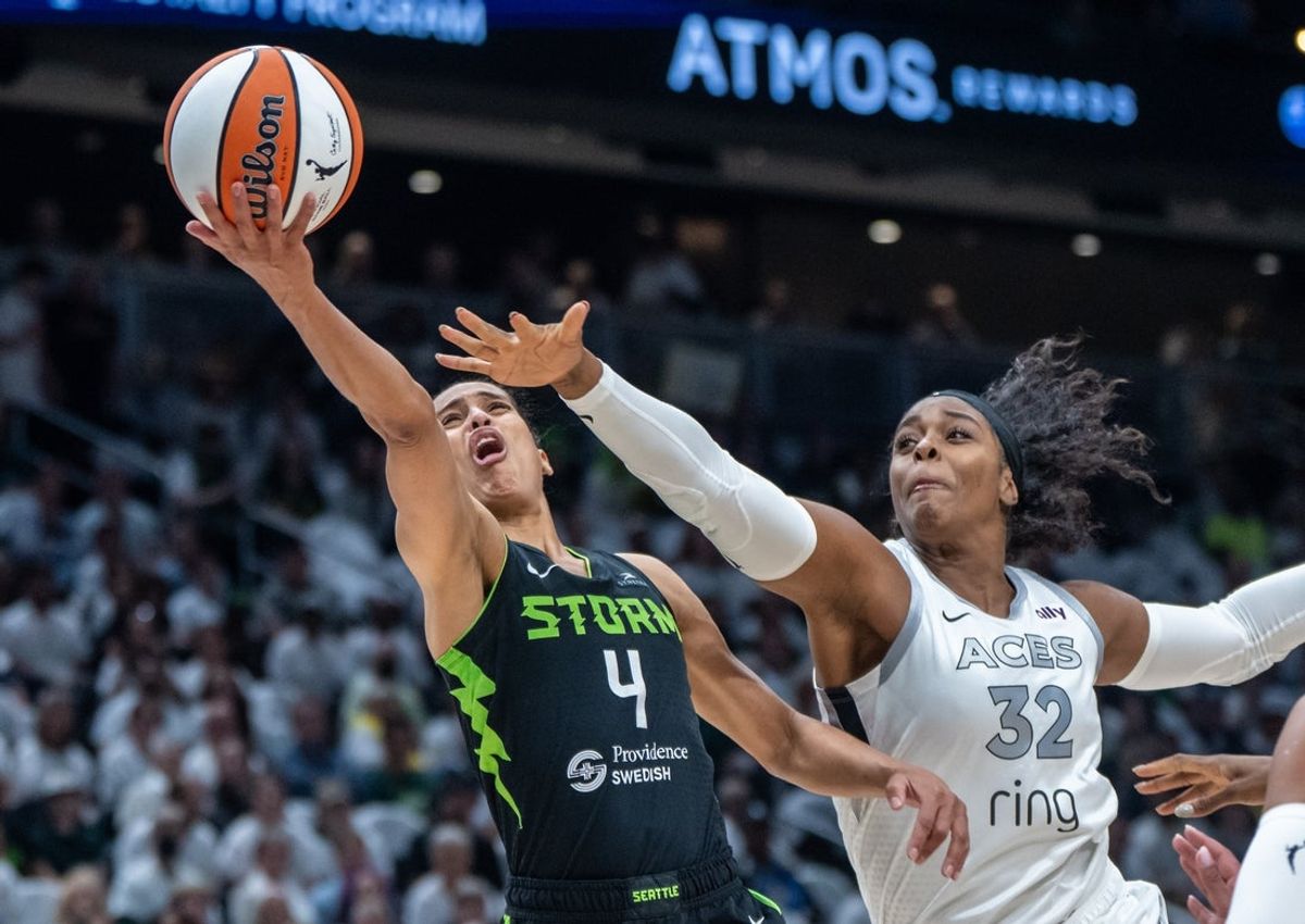 Sep 16, 2025; Seattle, Washington, USA; Seattle Storm guard Skylar Diggins (4) shoots the ball against Las Vegas Aces forward Cheyenne Parker-Tyus (32) in the first half during game two of round one for the 2025 WNBA Playoffs at Climate Pledge Arena. Mandatory Credit: Stephen Brashear-Imagn Images